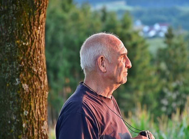 picture of an elderly man looking into the horizon
